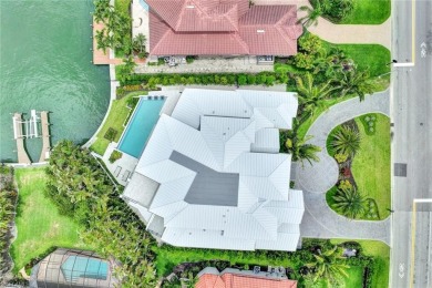 Experience unparalleled luxury in this exceptional bay front on The Moorings Country Club in Florida - for sale on GolfHomes.com, golf home, golf lot