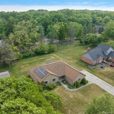 Welcome to this brick ranch home nestled in a highly on Pine Trace Golf Club in Michigan - for sale on GolfHomes.com, golf home, golf lot