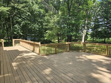 Beautiful setting on just under an acre of a private wooded lot on Inverness Country Club in Michigan - for sale on GolfHomes.com, golf home, golf lot