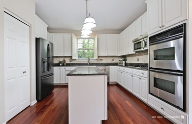 From the moment you arrive, the wrap-around porch invites you to on White Deer Run Golf Club in Illinois - for sale on GolfHomes.com, golf home, golf lot