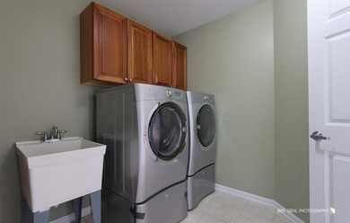 From the moment you arrive, the wrap-around porch invites you to on White Deer Run Golf Club in Illinois - for sale on GolfHomes.com, golf home, golf lot