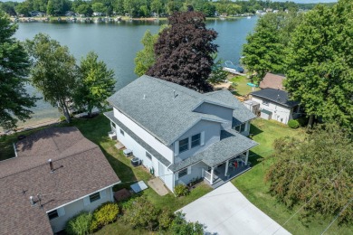 Incredible Main Canadian Lakes waterfront home.  One of the on Canadian Lakes Country Club-The Pines Course in Michigan - for sale on GolfHomes.com, golf home, golf lot