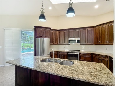 Discover your dream home at 9529 Northcliffe Blvd, Spring Hill on Oak Hills Country Club in Florida - for sale on GolfHomes.com, golf home, golf lot