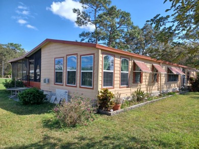 Well kept manufactured home in sunny East Orlando Florida on Fairways Country Club in Florida - for sale on GolfHomes.com, golf home, golf lot