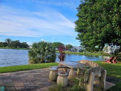 This charming 1 bedroom, 1.5 bathroom residence in Century on Hillsboro Pines Golf in Florida - for sale on GolfHomes.com, golf home, golf lot