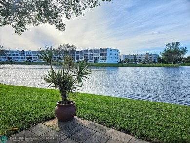 This charming 1 bedroom, 1.5 bathroom residence in Century on Hillsboro Pines Golf in Florida - for sale on GolfHomes.com, golf home, golf lot