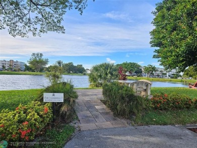 This charming 1 bedroom, 1.5 bathroom residence in Century on Hillsboro Pines Golf in Florida - for sale on GolfHomes.com, golf home, golf lot