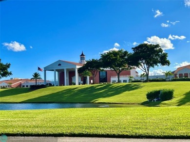 This charming 1 bedroom, 1.5 bathroom residence in Century on Hillsboro Pines Golf in Florida - for sale on GolfHomes.com, golf home, golf lot