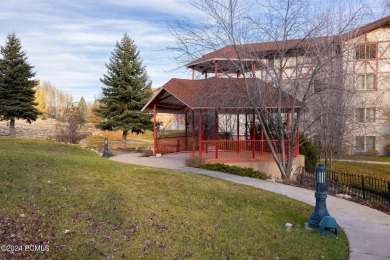 Embrace the charm of alpine living in this elegant second-floor on Homestead Golf Club and Resort in Utah - for sale on GolfHomes.com, golf home, golf lot