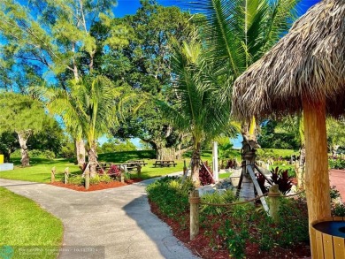 This charming 1 bedroom, 1.5 bathroom residence in Century on Hillsboro Pines Golf in Florida - for sale on GolfHomes.com, golf home, golf lot