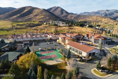 Embrace the charm of alpine living in this elegant second-floor on Homestead Golf Club and Resort in Utah - for sale on GolfHomes.com, golf home, golf lot