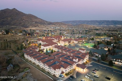 Embrace the charm of alpine living in this elegant second-floor on Homestead Golf Club and Resort in Utah - for sale on GolfHomes.com, golf home, golf lot