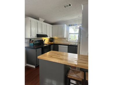 This charming and fully furnished 2-bedroom home is beautifully on Schalamar Creek Golf and Country Club in Florida - for sale on GolfHomes.com, golf home, golf lot