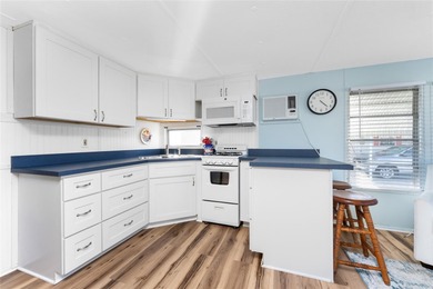 Simplify life with this charming turnkey-furnished mobile home on Boca Royale Golf and Country Club in Florida - for sale on GolfHomes.com, golf home, golf lot