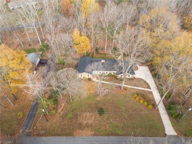 Welcome to this beautiful brick ranch with a walkout basement on Oak Hills Golf and Event Center in North Carolina - for sale on GolfHomes.com, golf home, golf lot