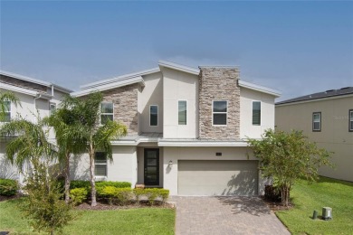 This exceptional 8-bedroom, 5-bathroom home in ChampionsGate is on ChampionsGate Golf Resort in Florida - for sale on GolfHomes.com, golf home, golf lot