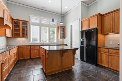 Located in the heart of Southwood, this exceptional home offers on Southwood Golf Club in Florida - for sale on GolfHomes.com, golf home, golf lot