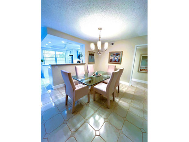 SPECTACULAR EXPANSIVE WATER/GOLF VIEW from this REMODELED 2nd on Wynmoor Golf Course in Florida - for sale on GolfHomes.com, golf home, golf lot