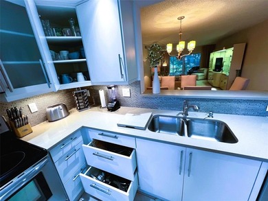 SPECTACULAR EXPANSIVE WATER/GOLF VIEW from this REMODELED 2nd on Wynmoor Golf Course in Florida - for sale on GolfHomes.com, golf home, golf lot