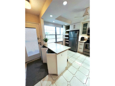 SPECTACULAR EXPANSIVE WATER/GOLF VIEW from this REMODELED 2nd on Wynmoor Golf Course in Florida - for sale on GolfHomes.com, golf home, golf lot