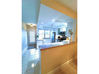 SPECTACULAR EXPANSIVE WATER/GOLF VIEW from this REMODELED 2nd on Wynmoor Golf Course in Florida - for sale on GolfHomes.com, golf home, golf lot