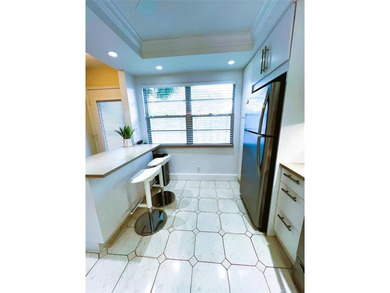 SPECTACULAR EXPANSIVE WATER/GOLF VIEW from this REMODELED 2nd on Wynmoor Golf Course in Florida - for sale on GolfHomes.com, golf home, golf lot