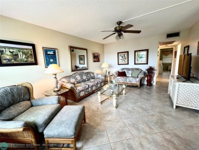 LOCATION! LOCATION!! THIS LOVELY HOME IS SITUATED DIRECTLY AROSS on Hillsboro Pines Golf in Florida - for sale on GolfHomes.com, golf home, golf lot