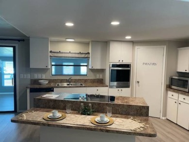 TIRED OF SNOW,ICE AND COLD, TRADE IT IN FOR SUN,WARM AND WHITE on Del Tura Golf and Country Club in Florida - for sale on GolfHomes.com, golf home, golf lot