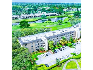 EXPANSIVE GOLF/WATER/CLUBHOUSE VIEW from this Large LUXURY MODEL on Wynmoor Golf Course in Florida - for sale on GolfHomes.com, golf home, golf lot