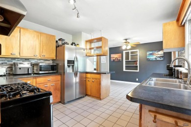 Welcome home to this spacious and full-of-character 5-bedroom on Meadowbrook Golf Course in South Dakota - for sale on GolfHomes.com, golf home, golf lot