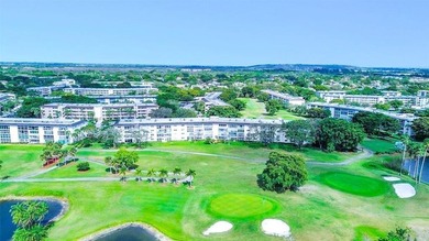 EXPANSIVE GOLF/WATER/CLUBHOUSE VIEW from this Large LUXURY MODEL on Wynmoor Golf Course in Florida - for sale on GolfHomes.com, golf home, golf lot