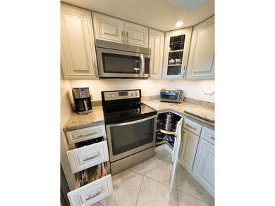 EXPANSIVE GOLF/WATER/CLUBHOUSE VIEW from this Large LUXURY MODEL on Wynmoor Golf Course in Florida - for sale on GolfHomes.com, golf home, golf lot