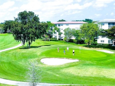 EXPANSIVE GOLF/WATER/CLUBHOUSE VIEW from this Large LUXURY MODEL on Wynmoor Golf Course in Florida - for sale on GolfHomes.com, golf home, golf lot