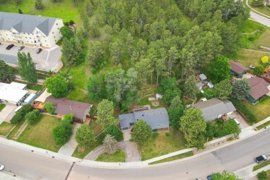 Welcome home to this spacious and full-of-character 5-bedroom on Meadowbrook Golf Course in South Dakota - for sale on GolfHomes.com, golf home, golf lot