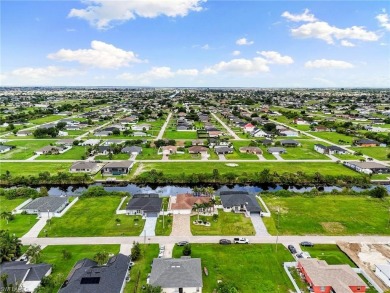 Step into your slice of paradise at 1004 NW 12th Ave, Cape Coral on Burnt Store Golf Club in Florida - for sale on GolfHomes.com, golf home, golf lot