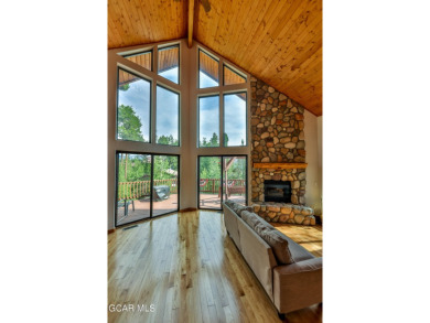 This classic Columbine Lake mountain home is a 4BR/ 4BA with on Grand Lake Golf Course in Colorado - for sale on GolfHomes.com, golf home, golf lot