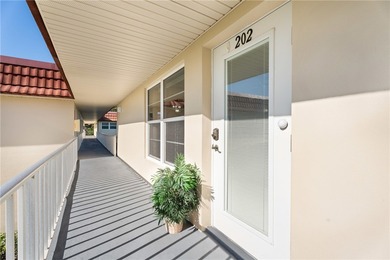 Turnkey 2BR/2BA corner condo in Vista Royale, a desirable 55+ on The American Golf Club in Florida - for sale on GolfHomes.com, golf home, golf lot