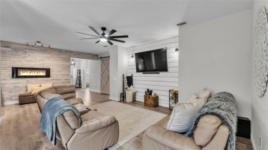 Welcome to 4565 Fairway Oaks Drive - a stunning 4-bedroom on Imperial Lakes Country Club in Florida - for sale on GolfHomes.com, golf home, golf lot