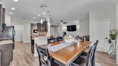Welcome to 4565 Fairway Oaks Drive - a stunning 4-bedroom on Imperial Lakes Country Club in Florida - for sale on GolfHomes.com, golf home, golf lot