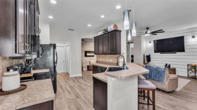 Welcome to 4565 Fairway Oaks Drive - a stunning 4-bedroom on Imperial Lakes Country Club in Florida - for sale on GolfHomes.com, golf home, golf lot