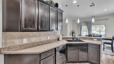 Welcome to 4565 Fairway Oaks Drive - a stunning 4-bedroom on Imperial Lakes Country Club in Florida - for sale on GolfHomes.com, golf home, golf lot