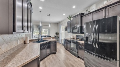 Welcome to 4565 Fairway Oaks Drive - a stunning 4-bedroom on Imperial Lakes Country Club in Florida - for sale on GolfHomes.com, golf home, golf lot