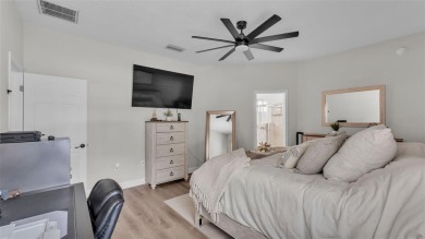 Welcome to 4565 Fairway Oaks Drive - a stunning 4-bedroom on Imperial Lakes Country Club in Florida - for sale on GolfHomes.com, golf home, golf lot