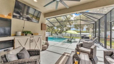 Welcome to 4565 Fairway Oaks Drive - a stunning 4-bedroom on Imperial Lakes Country Club in Florida - for sale on GolfHomes.com, golf home, golf lot