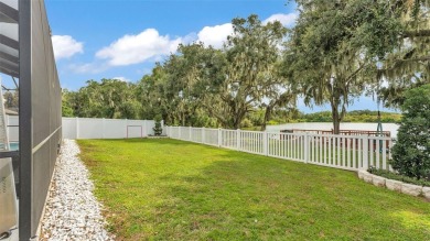 Welcome to 4565 Fairway Oaks Drive - a stunning 4-bedroom on Imperial Lakes Country Club in Florida - for sale on GolfHomes.com, golf home, golf lot