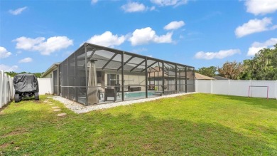 Welcome to 4565 Fairway Oaks Drive - a stunning 4-bedroom on Imperial Lakes Country Club in Florida - for sale on GolfHomes.com, golf home, golf lot