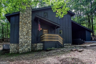 Nestled on a desirable corner lot near the North Gate, this on The Highlands Course at Lake Arrowhead in Georgia - for sale on GolfHomes.com, golf home, golf lot