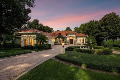 Tucked within the gates of Isleworth Golf Community and Country on Isleworth Golf and Country Club in Florida - for sale on GolfHomes.com, golf home, golf lot