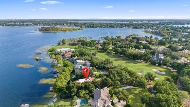 Tucked within the gates of Isleworth Golf Community and Country on Isleworth Golf and Country Club in Florida - for sale on GolfHomes.com, golf home, golf lot