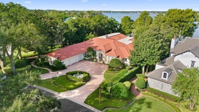 Tucked within the gates of Isleworth Golf Community and Country on Isleworth Golf and Country Club in Florida - for sale on GolfHomes.com, golf home, golf lot